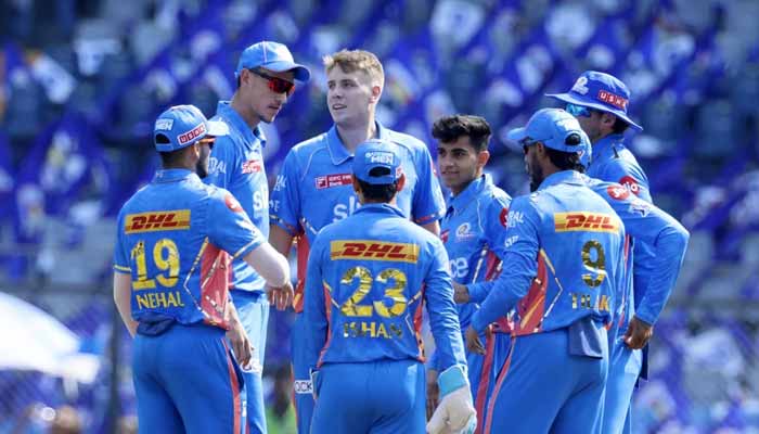 Australia all-rounder Cameron Green celebrate with Mumbai Indian players after taking a wicket on April 16, 2023. — BCCI