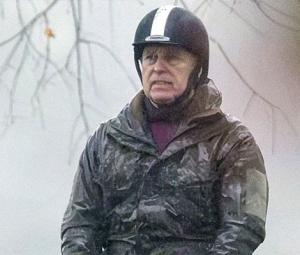 Andrew Mountbatten-Windsor takes soggy solo ride while daughters dine at Palace