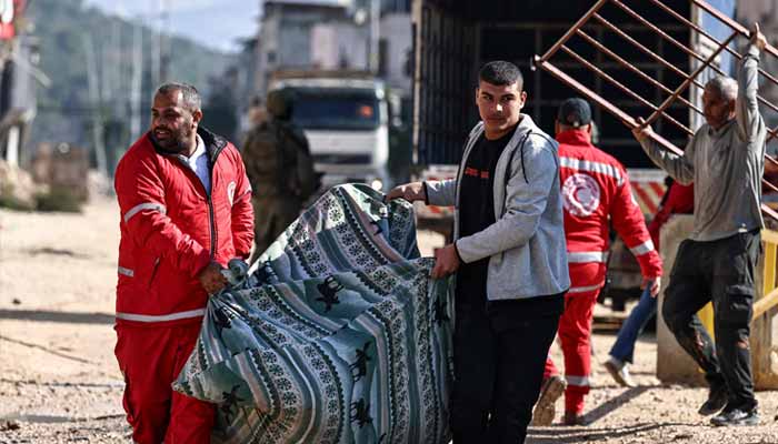 Red Crescent members assist residents of the Nur Shams refugee camp in collecting belongings ahead of the Israeli military demolition of residential buildings in the camp near Tulkarem in the Israeli-occupied West Bank on December 17, 2025. — AFP
