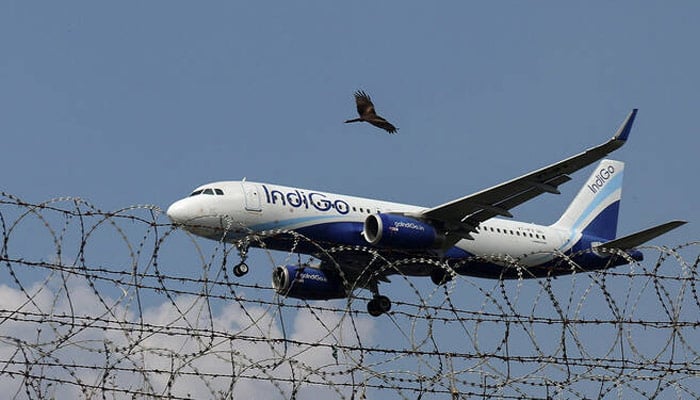 An IndiGo Airlines aircraft flies low as it prepares to land in Mumbai, India, on October 22, 2025. — Reuters