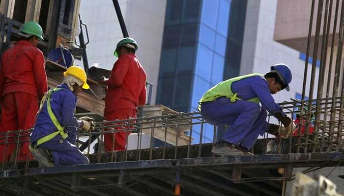 Foreign labourers work at the construction site of a building in Riyadh November 27, 2013. — Reuters