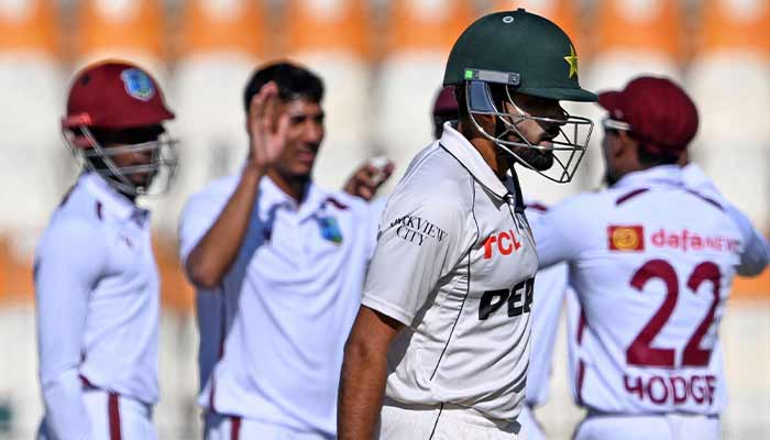 West Indies’ players celebrate as Pakistan’s Babar Azam walks back to the pavilion after his dismissal during the first day of the second Test cricket match between Pakistan and West Indies at the Multan Cricket Stadium in Multan on January 25, 2025. — AFP