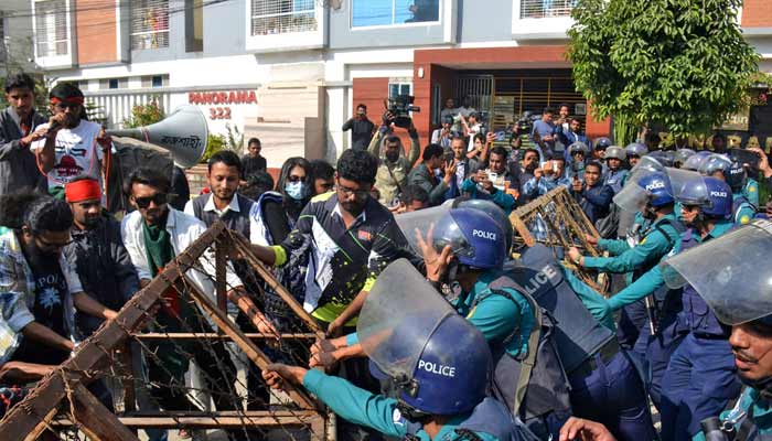 Bangladeshi police try to stop demonstrators as they march towards the assistant Indian high commissioner office in Rajshahi on December 18, 2025.—AFP