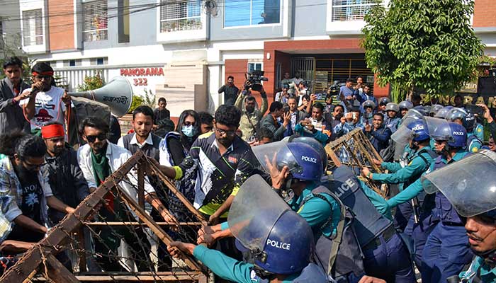 Bangladeshi police try to stop demonstrators as they march towards the assistant Indian high commissioner office in Rajshahi on December 18, 2025. — AFP