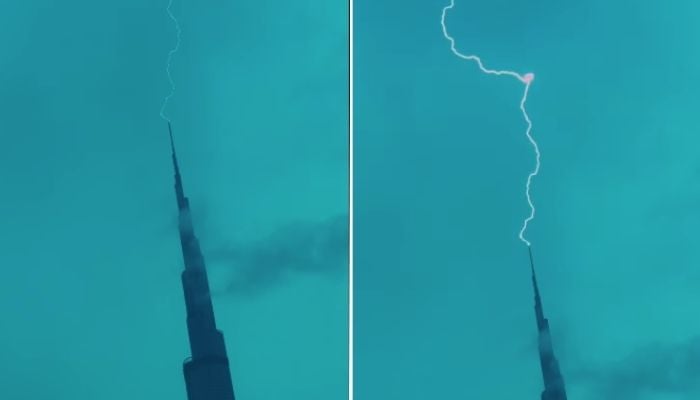 Lightning strikes the tip of the Burj Khalifa as storm clouds gather over Dubai during heavy rainfall on December 18, 2025. — Instagram@Fazza