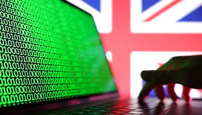 Illustration shows a laptop with binary codes displayed in front of the UK flag.— Reuters/File