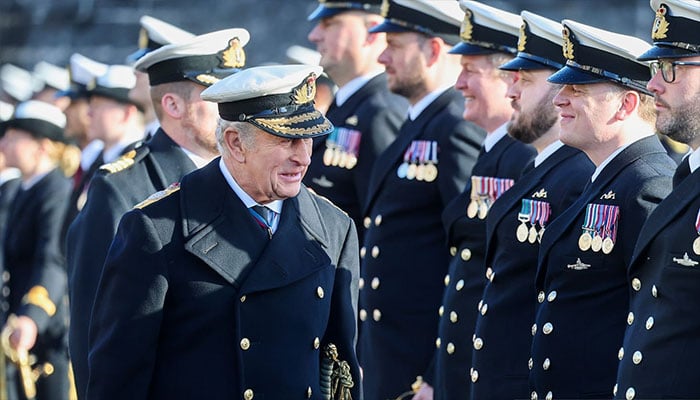 King Charles smiles while inspecting cadets
