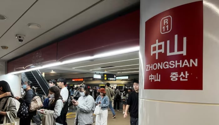 People walk at Zhongshan station, following an incident in which a person released smoke bombs and attacked bystanders, in Taipei, Taiwan, December 19, 2025. — Reuters