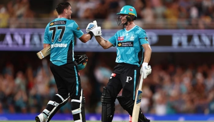 Brisbane Heats Matt Renshaw and Jack Wildermuth celebrate together, Brisbane Heat vs Perth Scorchers, BBL, Brisbane, December 19, 2025. — Cricket Australia