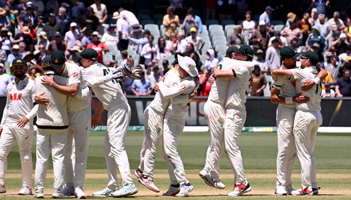 Australia players celebrate after taking the last England wicket on the final day of the third Ashes cricket Test match between Australia and England at the Adelaide Oval in Adelaide on December 21, 2025.— AFP