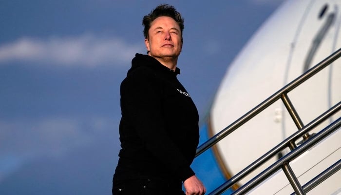Tesla CEO Elon Musk boards Air Force One,Morristown Municipal Airport in Morristown, New Jersey, US, March 22, 2025. — Reuters
