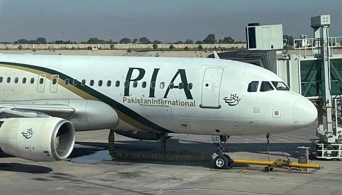 View of the PIA passenger plane, taken through a glass panel, at Islamabad International Airport, Pakistan, on October 3, 2023. — Reuters