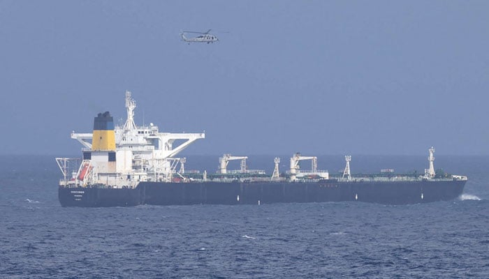 A US military helicopter flies over the Panama-flagged Centuries, which was intercepted by the US Coast Guard, days after US President Donald Trump announced a blockade of all sanctioned oil tankers entering and leaving Venezuela, east of Barbados in the Caribbean Sea December 20, 2025. — Reuters