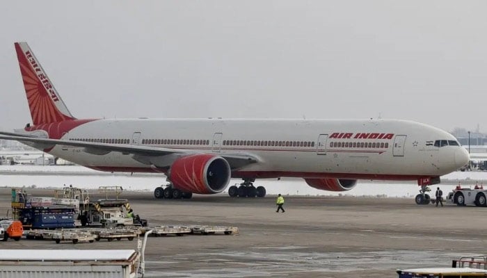 An Air India Boeing 777-300ER plane is towed at OHare International Airport in Chicago, Illinois, US, November 30, 2018. — Reuters