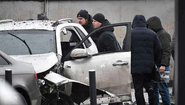 Investigators work at the car blast site in southern Moscow on December 22, 2025. Lieutenant General Fanil Sarvarov, head of the training department within the General Staff, was killed in Moscow on December 22, 2025.— AFP