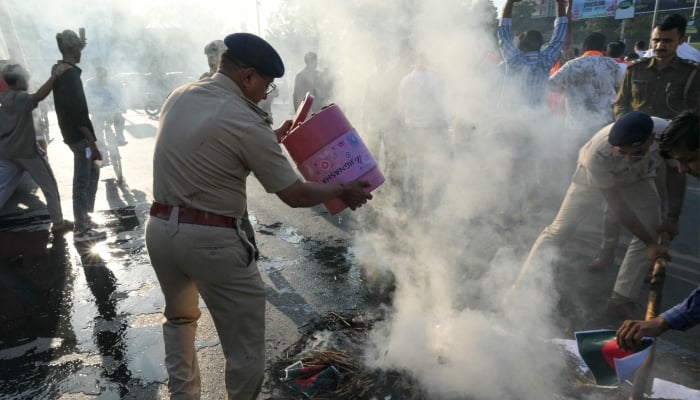 Vishva Hindu Parishad (VHP) activists set on fire Bangladeshs national flag and an effigy during a protest in Ahmedabad, India, December 22, 2025. — AFP