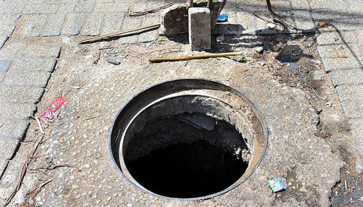 A view of open sewerage manhole in Hyderabad. — APP/File
