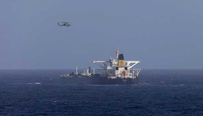 A US military helicopter flies over the Panama-flagged Centuries, which was intercepted by the US Coast Guard, days after US President Donald Trump announced a blockade of all sanctioned oil tankers entering and leaving Venezuela, east of Barbados in the Caribbean Sea December 20, 2025. — Reuters
