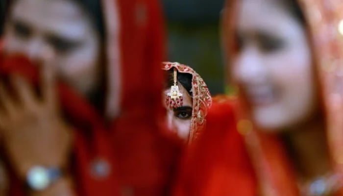 A representational image showing multiple brides.— AFP/File