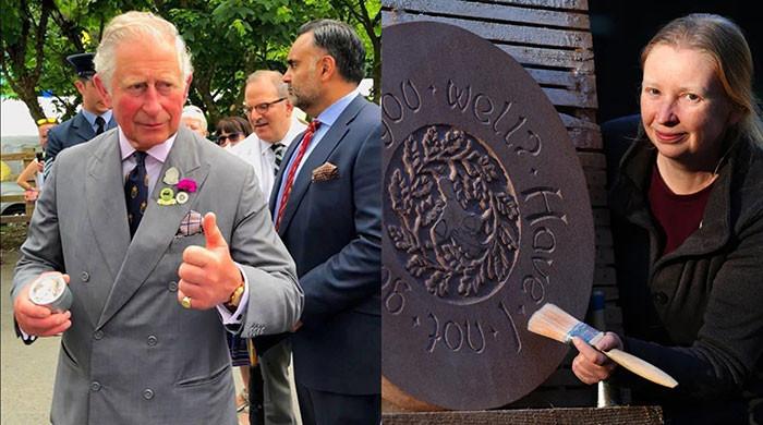 King Charles celebrates future craftsmen building magical woodland hide