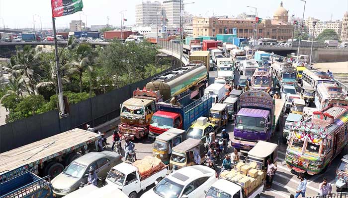An undated image captures trucks and other heavy vehicles passing through Karachis ICI Bridge. — Online/File