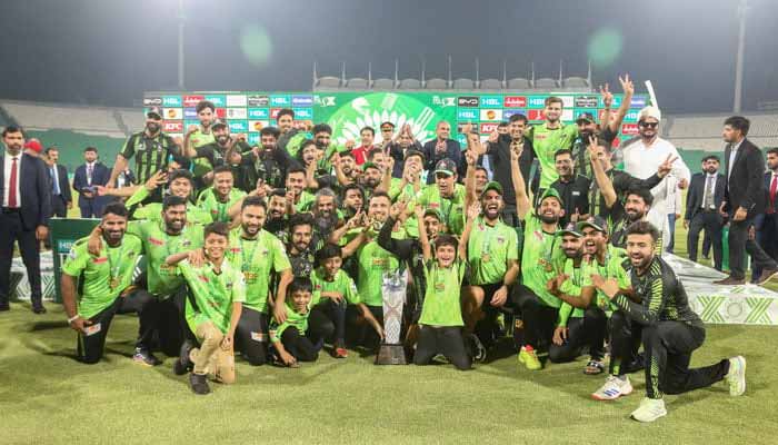 Lahore Qalandars players and support staff celebrate winning the PSL X after beating Quetta Gladiators in the final at the Gaddafi Stadium in Lahore on May 25, 2025. — PSL