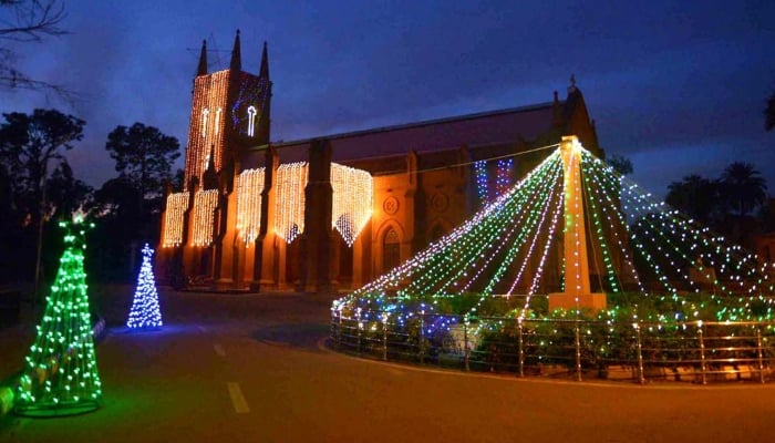 An illuminated view of St Johns Church decorated with colourful lights in preparation for Christmas celebrations, Peshawar, December 24, 2025. — APP