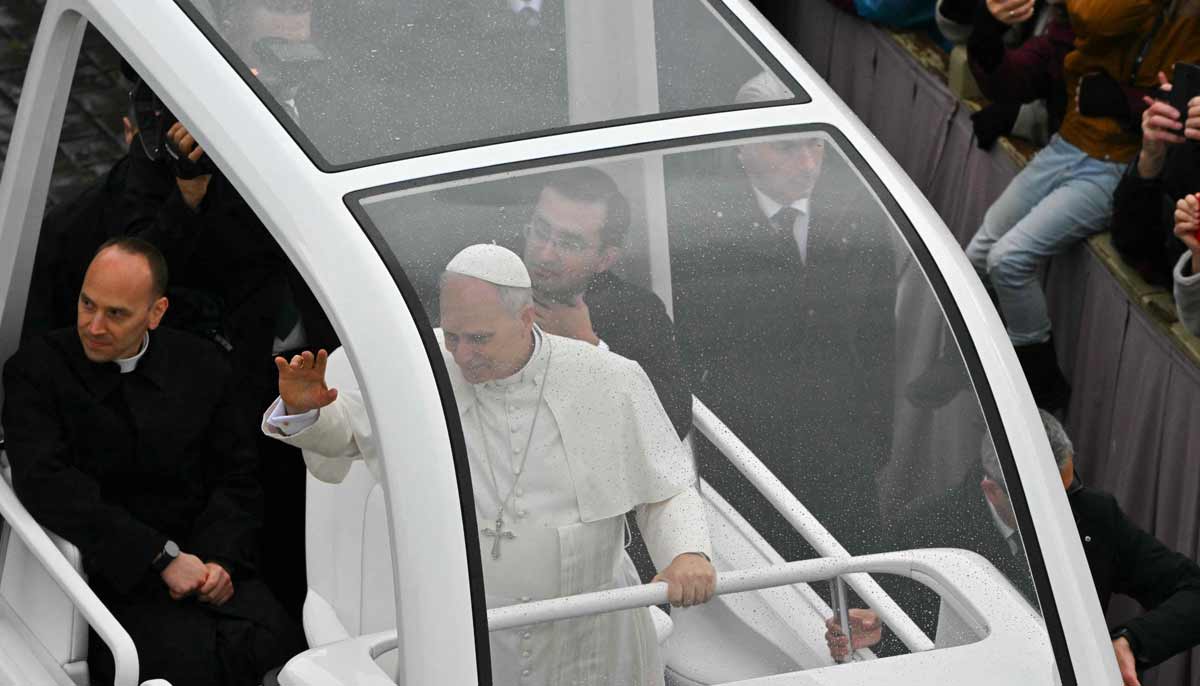 Pope Leo XIV waves to faithfull as he arrives aboard the popemobile ahead of addressing the Urbi et Orbi message and blessing to the city and the world as part of Christmas celebrations, at St Peter’s square in the Vatican on December 25, 2025.— AFP