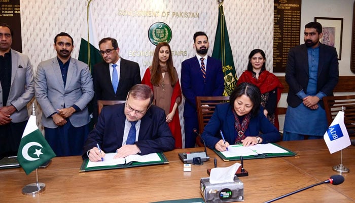 Economic Affairs Division Secretary Muhammad Humair Karim and Asian Development Bank Country Director Emma Fan are signing agreements between Pakistan and ADB on December 25, 2025. — PID