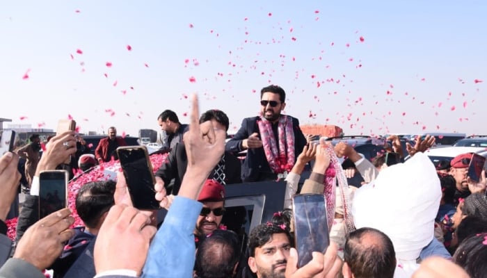 PTI workers welcome KP Chief Minister Sohail Afridi after his reached Attock while enroute to Punjab, December 26, 2025. — X/@JunaidAkbarMNA