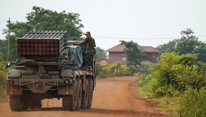 A Cambodian military personnel stands on a BM-21 Grad multiple rocket launcher, around 40 km (24 miles) from the disputed Ta Moan Thom temple, after Thailand and Cambodia exchanged heavy artillery on Friday as their worst fighting in more than a decade stretched for a second day, in Oddar Meanchey province, Cambodia, July 25, 2025. — Reuters