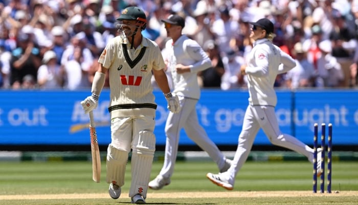 Australia’s Travis Head (left) smiles after he was dismissed on the second day of the fourth Ashes Test between Australia and England at the Melbourne Cricket Ground, Melbourne, December 27, 2025. — AFP