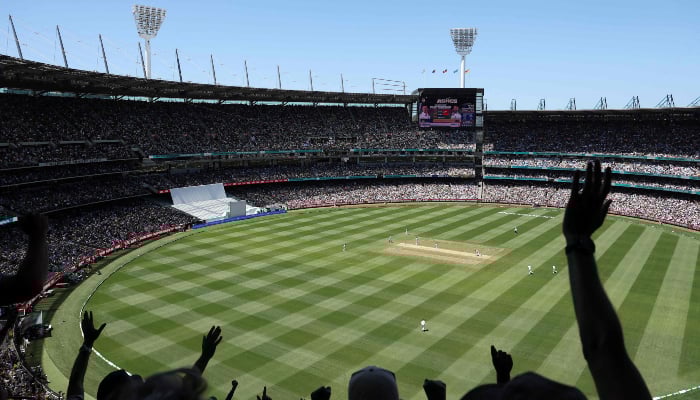 Fans cheer as Englands Ben Duckett is dismissed during the second day of the fourth Ashes cricket Test match between Australia and England at the Melbourne Cricket Ground (MCG) in Melbourne on December 27, 2025. — AFP