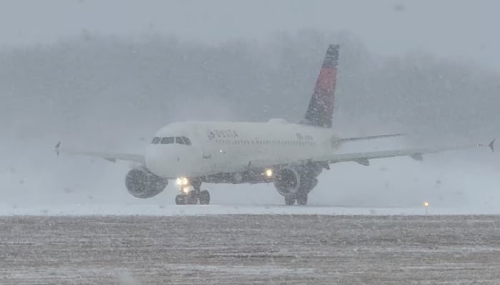 A Delta Air Lines plane prepares to take off during a winter storm at Greater Rochester International Airport in Rochester, New York, US, December 26, 2025. — Reuters