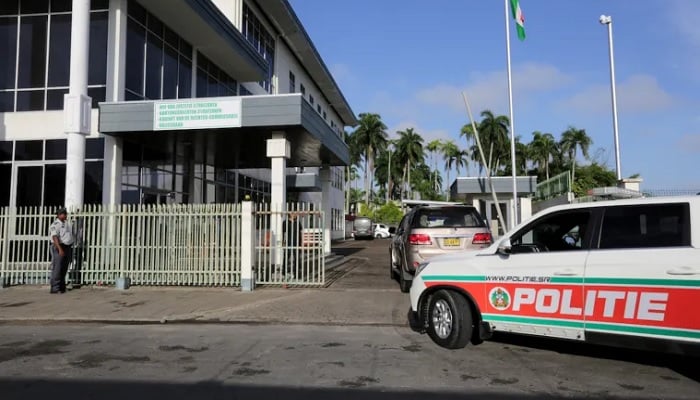A police car outside a Suriname court. Surinamese journalist Mones Nazarali was arrested and charged with defamation and several other crimes on May 3, 2022. — Reuters