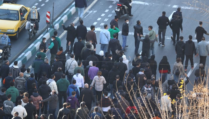 Shopkeepers and traders protest in the street against the economic conditions and Irans embattled currency in Tehran on December 29, 2025. — AFP