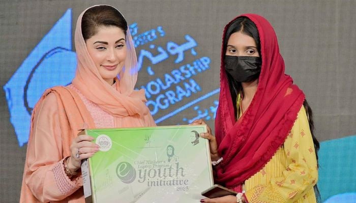 Punjab CM Maryam Nawaz distributes laptops among students in this undated image. Facebook/@TheMaryamNSharif