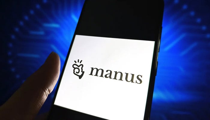 The Manus AI logo is displayed on a smartphone screen. — Reuters