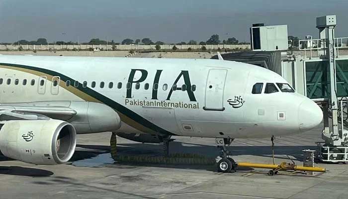 View of the PIA passenger plane, taken through a glass panel, at Islamabad International Airport, Pakistan, on October 3, 2023. — Reuters