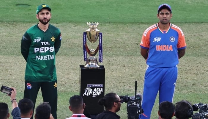 Skippers Salman Agha (left) and Suryakumar Yadav face off ahead of the toss in the Asia Cup final between India and Pakistan in Dubai on September 28, 2025. — AFP