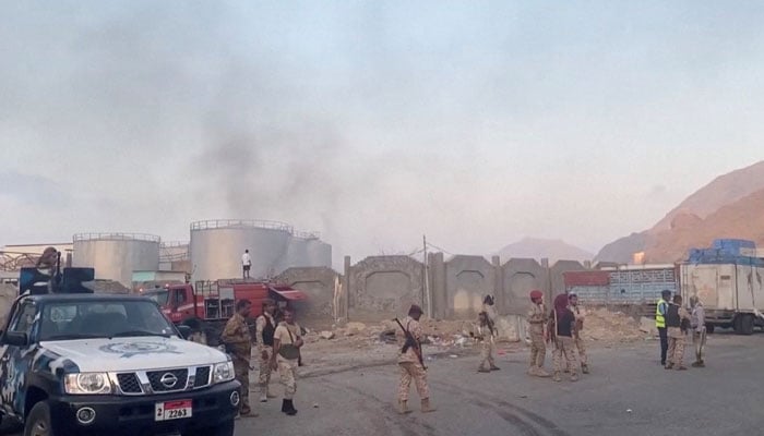 Smoke rises in the aftermath of a Saudi-led coalition airstrike in Yemens southern port of Mukalla, in this screengrab from a handout video obtained by Reuters on December 30, 2025. — Reuters