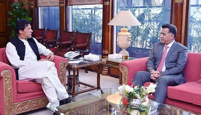 Ex-PM Imran Khan (left) in conversation with then former ISI chief Faiz Hamid at the PM Office in Islamabad. — PM Office/File