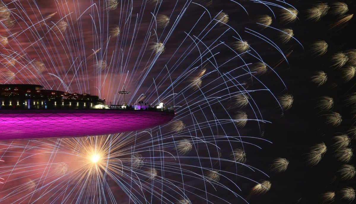 People watch fireworks from the Marina Bay Sands hotel in Singapore. — Reuters
