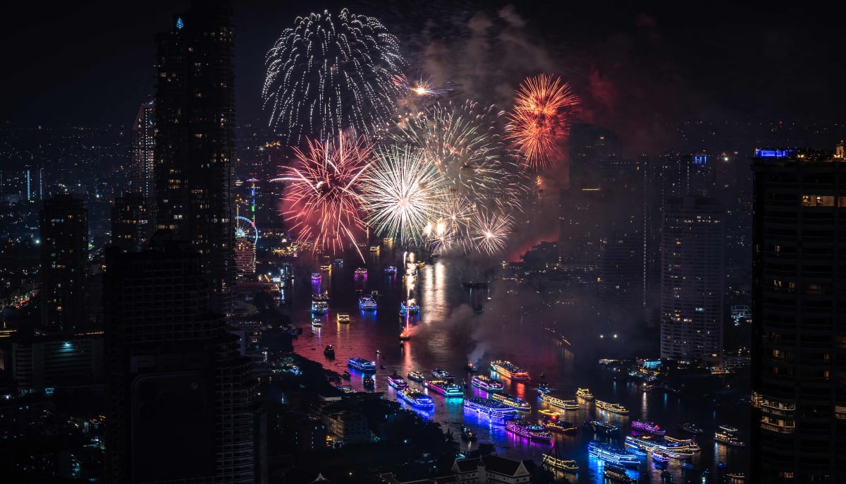 Fireworks light up the midnight sky over the Chao Phraya River during 2026 New Years Day celebrations in Bangkok on January 1, 2026. — AFP
