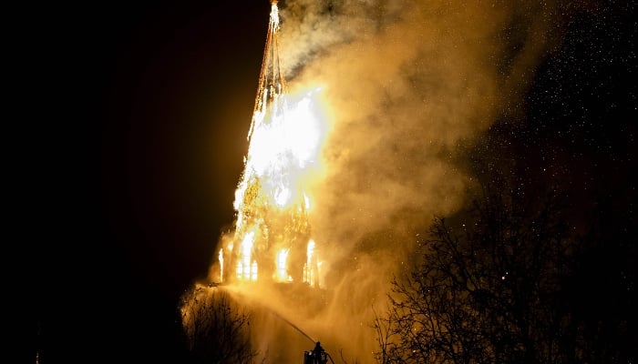 A fire tears through the Vondelkerk church tower in Amsterdam on New Year´s eve, on January 1, 2026. — AFP