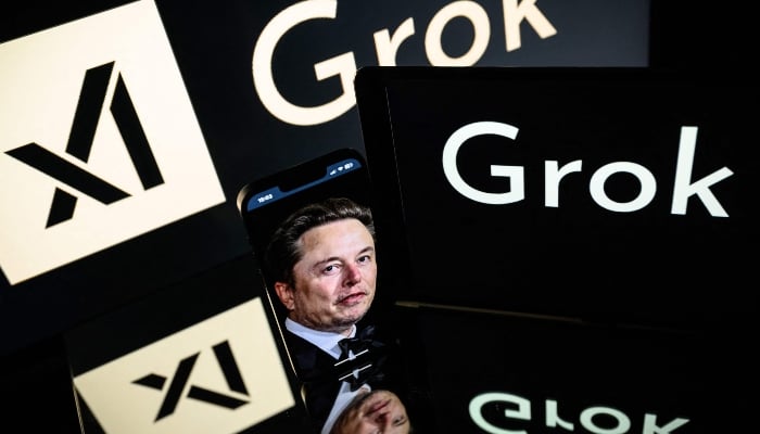 This photograph, taken on January 13, 2025, in Toulouse, shows screens displaying the logo of Grok and South African businessman Elon Musk. — AFP