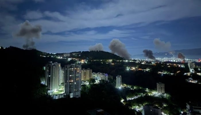 Smoke seen rising from the buildings in Venezuelan capital Caracas on January 3, 2026. —X@@AbujomaaGaza