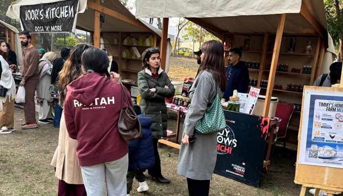 Customers visit stalls set up at organic market at Islamabad’s F-7 Park on Jan 3, 2025. — CDA