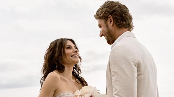 Sarah Shahi reflects on toll of public romance after Adam Demos breakup