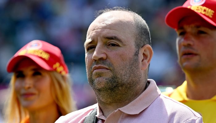 Ahmed al Ahmed, the man who tackled and disarmed one of the Bondi Beach attackers, stands for the national anthems alongside other first responders after receiving a guard of honour for their service, on day one of the fifth Ashes cricket Test match between Australia and England at the Sydney Cricket Ground (SCG) in Sydney on January 4, 2026. — AFP